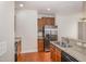 Kitchen featuring granite countertops, wood cabinets, and stainless steel appliances at 141 Shad Boat Ln, Clayton, NC 27520