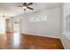 Bright living room featuring hardwood floors, a ceiling fan, and sliding glass doors at 141 Shad Boat Ln, Clayton, NC 27520