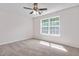 Bedroom featuring a window, ceiling fan, and carpet flooring at 144 Holly Mountain Rd, Holly Springs, NC 27540