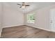 Bedroom with a ceiling fan, window, and door at 144 Holly Mountain Rd, Holly Springs, NC 27540