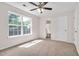 Bedroom featuring a window, ceiling fan, and carpet flooring at 144 Holly Mountain Rd, Holly Springs, NC 27540