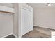 Built-in closet and storage space with bi-fold doors and modern flooring in a bright, open space at 144 Holly Mountain Rd, Holly Springs, NC 27540