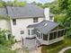 Aerial view of the backyard featuring a deck and screened in porch at 15 Aman Ct, Durham, NC 27713