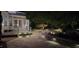 Beautiful outdoor lighting accents the backyard flagstone patio and screened-in porch for nighttime enjoyment at 15 Aman Ct, Durham, NC 27713