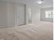 Large bedroom featuring a bathroom and a bright window for natural light at 15 Aman Ct, Durham, NC 27713