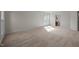 Expansive carpeted bedroom with neutral walls, large windows, and ample natural light at 15 Aman Ct, Durham, NC 27713