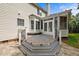 Cozy deck area featuring tiered steps, modern railings, and flagstone patio at 15 Aman Ct, Durham, NC 27713