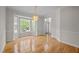 Inviting dining room with hardwood floors, bright lighting, and large windows with natural light at 15 Aman Ct, Durham, NC 27713