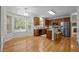 Eat-in kitchen with wood cabinets, stainless steel appliances, and a breakfast bar at 15 Aman Ct, Durham, NC 27713
