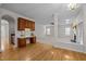 Open concept living and office space with hardwood floors and built-in desk at 15 Aman Ct, Durham, NC 27713