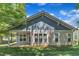 Inviting backyard featuring a covered patio and lots of windows to bring the outdoors in at 151 Cobble Ridge Dr, Pittsboro, NC 27312
