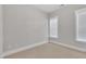 Cozy bedroom featuring carpet, a neutral paint, and windows with white trim at 151 Cobble Ridge Dr, Pittsboro, NC 27312