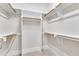 A walk-in closet with multiple levels of shelves and racks at 151 Cobble Ridge Dr, Pittsboro, NC 27312