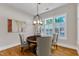 Dining room with a modern light fixture and multiple windows at 151 Cobble Ridge Dr, Pittsboro, NC 27312