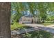 Inviting home with a charming front porch, two-car garage, and well-maintained landscaping at 151 Cobble Ridge Dr, Pittsboro, NC 27312