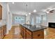 Bright kitchen with stainless steel appliances, granite countertops and hardwood floors at 151 Cobble Ridge Dr, Pittsboro, NC 27312