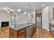 Modern kitchen with granite countertops, stainless steel appliances and hardwood floors at 151 Cobble Ridge Dr, Pittsboro, NC 27312