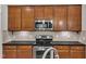 Modern kitchen with stainless steel appliances, granite countertops and tile backsplash at 151 Cobble Ridge Dr, Pittsboro, NC 27312