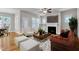 Cozy living room featuring hardwood floors, fireplace, and ample seating at 151 Cobble Ridge Dr, Pittsboro, NC 27312