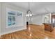 Open living area with hardwood floors, fireplace, and kitchen at 151 Cobble Ridge Dr, Pittsboro, NC 27312