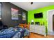 Fun bedroom featuring a Minecraft theme, black and green accent walls, and a distressed white dresser at 1703 Keogh St, Burlington, NC 27215