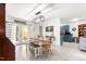 Dining area with farm table, bench seating, and view to kitchen area at 1703 Keogh St, Burlington, NC 27215