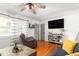 Well-lit living room with hardwood floors, neutral paint, and decorative shelving at 1703 Keogh St, Burlington, NC 27215