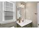 Bathroom featuring a single vanity with lots of natural light and a mirror at 1740 Golden Honey Dr, Wake Forest, NC 27587