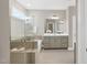 Bright bathroom with a glass-enclosed shower, soaking tub, and dual sinks at 1740 Golden Honey Dr, Wake Forest, NC 27587