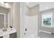 Well-lit bathroom featuring tub with tile flooring at 1740 Golden Honey Dr, Wake Forest, NC 27587
