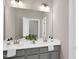 Bathroom vanity with dual sinks and large mirror at 1740 Golden Honey Dr, Wake Forest, NC 27587
