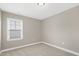 Neutral bedroom with window and carpet flooring at 1740 Golden Honey Dr, Wake Forest, NC 27587