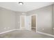 Neutral bedroom with closet and doorway at 1740 Golden Honey Dr, Wake Forest, NC 27587