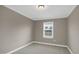 Neutral-colored bedroom with carpet floors and a single window providing natural light at 1740 Golden Honey Dr, Wake Forest, NC 27587
