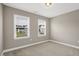 Bedroom with carpet flooring and natural light from two windows at 1740 Golden Honey Dr, Wake Forest, NC 27587