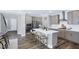 Well-equipped kitchen with a large island, seating, and stainless steel appliances, perfect for entertaining at 1740 Golden Honey Dr, Wake Forest, NC 27587