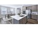 Modern kitchen with stainless appliances, quartz countertops, open to breakfast area, and dining area at 1740 Golden Honey Dr, Wake Forest, NC 27587