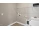 Laundry room with tile flooring, shelving, and a utility sink at 1740 Golden Honey Dr, Wake Forest, NC 27587
