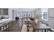 The open living room showcases natural light and transitions into the dining area and kitchen at 1740 Golden Honey Dr, Wake Forest, NC 27587