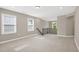 Spacious upstairs loft area with carpet floors, natural light, and a view of the stairwell at 1740 Golden Honey Dr, Wake Forest, NC 27587