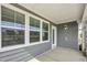 Screened in patio featuring natural lighting and light gray siding at 1740 Golden Honey Dr, Wake Forest, NC 27587