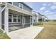 A lovely screened-in porch extends from the house to a well-maintained lawn at 1740 Golden Honey Dr, Wake Forest, NC 27587