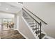 Staircase with wood treads and black metal balusters at 1740 Golden Honey Dr, Wake Forest, NC 27587