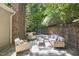 Outdoor seating area with comfortable wicker chairs and a sofa is great for socializing at 201 Red Bud Ln, Chapel Hill, NC 27514