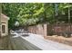 The backyard deck has brick accents and ample space for outdoor dining and lounging at 201 Red Bud Ln, Chapel Hill, NC 27514