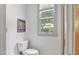 Well-lit bathroom features a toilet next to the window with natural light and neutral-colored decor at 201 Red Bud Ln, Chapel Hill, NC 27514