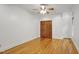 Cozy bedroom with hardwood floors, featuring double doors for added privacy and enhanced aesthetics at 201 Red Bud Ln, Chapel Hill, NC 27514
