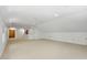 Spacious bonus room with neutral carpeting, recessed lighting, and bright white paint provides versatile living space at 201 Red Bud Ln, Chapel Hill, NC 27514