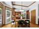 A well-appointed dining area with wood floors, wood trim, and a view of the outdoor patio at 201 Red Bud Ln, Chapel Hill, NC 27514