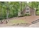 Charming brick and siding home on wooded lot with landscaped front yard at 201 Red Bud Ln, Chapel Hill, NC 27514